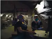  ?? JAE C. HONG — THE ASSOCIATED PRESS ?? Nurses Karla Salazar, right, and Marisol Perez work in a tent set up to help treat COVID-19 patients at El Centro Regional Medical Center in Imperial County in July.