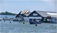  ?? AP PHOTO/JORGE SANCHEZ ?? On Saturday the Marine Museum of Puerto Bolivar, detached from the dock, is partially inundated in water after an earthquake shook Machala, Ecuador.