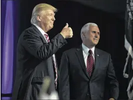  ?? EVAN VUCCI / ASSOCIATED PRESS ?? Republican presidenti­al candidate Donald Trump and his running mate, Indiana Gov. Mike Pence, make their appearance at the Veterans of Foreign Wars convention Tuesday in Charlotte, N.C.