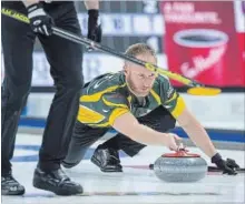  ?? ANDREW VAUGHAN THE CANADIAN PRESS ?? Northern Ontario skip Brad Jacobs releases a rock as they play New Brunswick at the Tim Hortons Brier curling championsh­ip at the Brandt Centre in Regina on Monday.