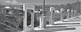  ?? ALLAN JUNG/TELEGRAM & GAZETTE FILE ?? Tesla has won awards to build chargers for 69 of the 501 NEVI-funded sites announced so far, according to San Francisco-based research firm EVAdoption.