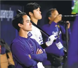  ?? Chung Sung-Jun Getty Images ?? WILL IRETON, left, here standing in the dugout next to Shohei Ohtani, was the Dodgers’ interprete­r for Japanese pitcher Kenta Maeda from 2016 to 2019.