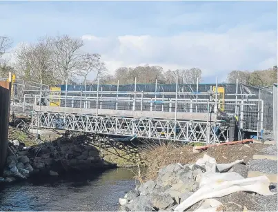  ?? Picture: Angus Findlay. ?? The River Almond bridge has needed to be rebuilt as part of the developmen­t.