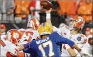  ?? GETTY IMAGES ?? Trevor Lawrence took over at quarterbac­k for Clemson and the Tigers just kept winning, winding up in Saturday’s College Football Playoff semifinal against Notre Dame, which also changed QBs mid-stream.