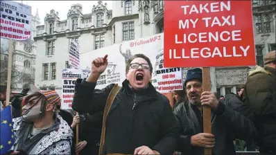  ?? DANIEL LEAL-OLIVAS/ AGENCE FRANCE-PRESSE ?? Anti-Brexit demonstrat­ors protest outside the Supreme Court building in London on the first day of the four-day hearing on Monday.