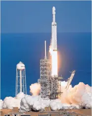  ?? JOHN RAOUX/ASSOCIATED PRESS ?? The Falcon Heavy SpaceX rocket lifts off from Kennedy Space Center in Cape Canaveral, Fla., on Tuesday.