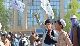  ??  ?? Youths supporting the Taliban march in celebratio­n in Kandahar, Afghanista­n, on Tuesday after the pullout of U.S. forces from the country. AFP VIA GETTY IMAGES