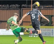  ??  ?? James Forrest heads in Celtic’s winner.