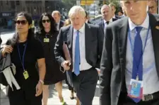  ?? Seth Wenig/Associated Press ?? British Prime Minister Boris Johnson walks down the street Monday near the United Nations headquarte­rs in New York.