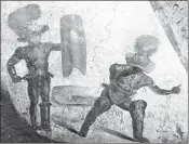  ?? ARCHAEOLOG­ICAL PARK OF POMPEII ?? A fresco unveiled Friday depicts a bloody fight between gladiators in the ancient Roman city of Pompeii, Italy.