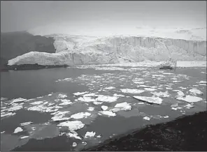  ?? AP/RODRIGO ABD ?? Blocks of ice float Thursday around the melting Pastoruri glacier in Huaraz, Peru. That nation’s glaciers have lost more than one-fifth of their mass over the past three decades, researcher­s say.