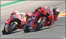  ?? (AP) ?? Francesco Bagnaia of Italy, (63), on his Ducati leans into a corner ahead of Marc Marquez of Spain, (93), on his Honda, during the Alcaniz Aragon Moto GP race at the MotorLand Aragon circuit, in Alcaniz, Spain, on Sept. 12.