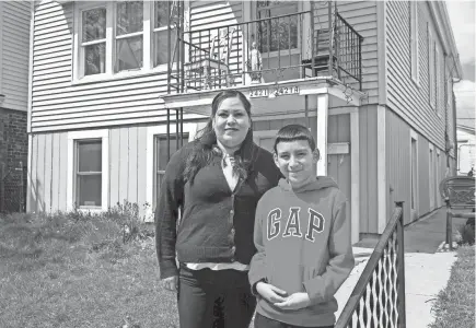  ?? ZHIHAN HUANG / MILWAUKEE JOURNAL SENTINEL ?? Llesavel Alanis, left, and her son David Alanis pose for a portrait in front of their house on May 3 in the Lincoln Village area. David is a sixth grade student at Carmen Middle School. During the coronaviru­s pandemic, schools are closed and students have to take online classes. David said he didn’t like online classes because it is harder for him to get help from teachers.