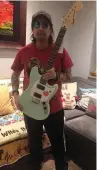  ??  ?? Phil Campbell with his guitar that is to be auctioned