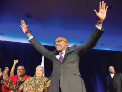  ?? TYLER LARIVIERE/SUN-TIMES ?? Kwame Raoul gets on stage to address the crowd Tuesday during his election night party in Chicago.