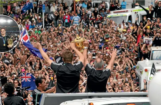  ?? STUFF ?? Richie McCaw, left, and Graham Henry show off the Webb Ellis Cup to delighted Auckland fans after a 2011 triumph that brought elation and relief in equal doses. Inset, McCaw with the Cup after the final.