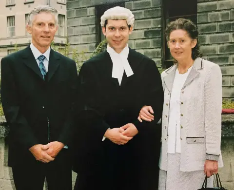  ??  ?? TRAGIC DECLINE: Ronan, here with his dad Tom and mother Maura, has seen his father’s mental health gradually get worse