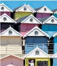  ??  ?? One owner adds yet more colour to beach huts in Walton-on-the-Naze in Essex