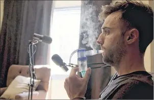  ?? ANDREW MACCORMACK/SUBMITTED PHOTO ?? In this scene from the documentar­y “Sickboy” Jeremy Saunders uses a nebulizer as part of his cystic fibrosis therapy. He does this twice a day for an hour each time. The vapour from the machine helps to break up the mucous in his lungs.