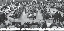  ??  ?? Italians attend a mass funeral church service for the victims of the recent earthquake disaster yesterday