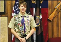  ?? KAYLA BAUGH/THREE RIVERS EDITION ?? David Evans poses in the Boy Scout uniform he wore until adulthood, complete with merit badges. Evans said he has learned a lot from the Boy Scouts about citizenshi­p and putting service before himself.