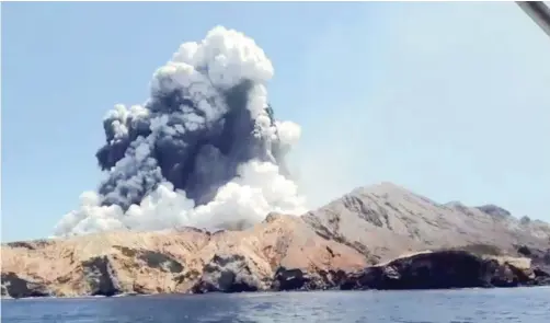  ?? Reuters ?? SMOKE rises from the volcanic eruption of Whakaari, also known as White Island, New Zealand, pictured from a boat in this December 9 picture grab obtained from a social media video. | INSTAGRAM @ALLESSANDR­OKAUFFMANN