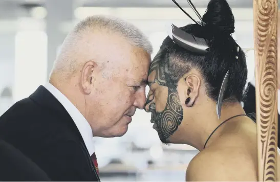  ??  ?? 2 Head coach Warren Gatland receives a hongi – a traditiona­l Maori greeting – after the British and Irish Lions squad arrived in New Zealand yesterday.