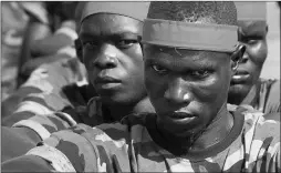  ?? Associated Press ?? A group of government soldiers wait in line during a military parade celebratin­g the national army on May 16 in Juba, South Sudan.