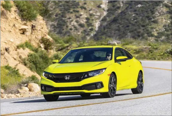  ?? PHOTOS COURTESY OF HONDA ?? In addition to being able to enjoy the extra control the Civic’s six-speed standard transmissi­on allows, there are some other items new for 2020. A mild refreshing adds a new grille, revised front and rear bumpers, and different headlights and fog light trim.