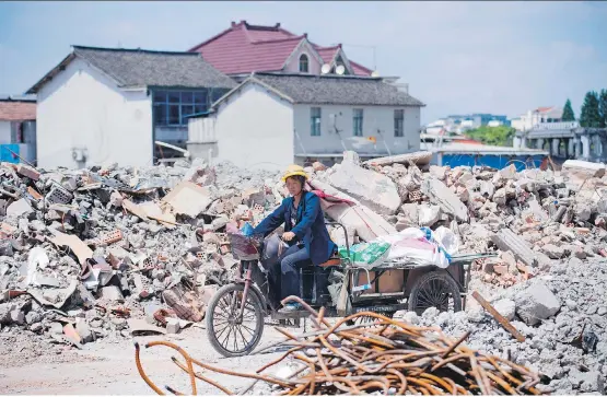  ?? JOHANNES EISELE/AFP/GETTY IMAGES ?? Moody’s ratings agency downgraded China’s credit score this week over its rising debt but investors don’t appear to be worried.