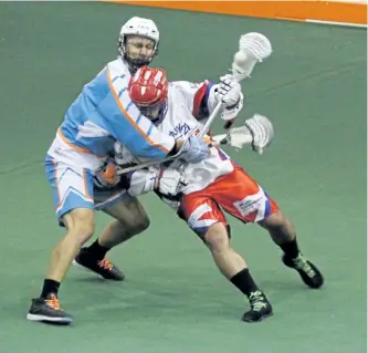  ?? SIX NATIONS CHIEFS PHOTO ?? Peterborou­gh Lakers Adam Jones tries to get by Six Nations Chiefs Adam Jones during Game 1 of their MSL final at Iroquois Lacrosse Arena in Oshweken on Tuesday night. Jones had four goals in a 10-7 Lakers win.