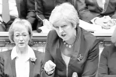  ??  ?? A still image taken from footage broadcast by the UK Parliament’s Parliament­ary Recording Unit (PRU) shows Britain’s Prime Minister Theresa May as she speaks during the weekly Prime Minister’s Questions (PMQs) session in the House of Commons in London....