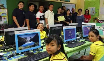  ??  ?? PARTNER NOT JUST SUPPLIER. AboitizPow­er goes the extra mile to support its valued customers’ efforts to help their host communitie­s. On March 5, 2019, the company donated 10 computer sets to Urdaneta I Central School in Pangasinan, a host school of its customer, Magic Mall.