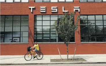  ?? SPENCER PLATT / GETTY IMAGES ?? Bulls on Tesla stock have become the minority with nine analysts saying buy, 11 hold and 12 rating it a sell, according to Bloomberg.