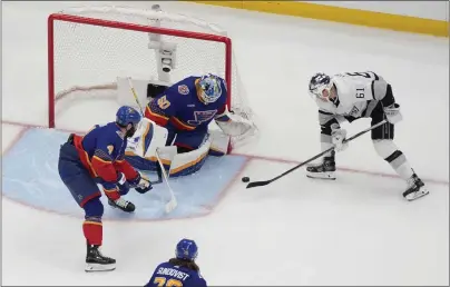  ?? JEFF ROBERSON — THE ASSOCIATED PRESS ?? The Kings' Trevor Lewis (61) can't get the puck past Blues goaltender Jordan Binnington, who had 40saves in Wednesday's game.