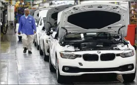  ?? PHOTO: BLOOMBERG ?? A BMW assembly plant. BMW SA said dealership “consolidat­ion is the name of the game”.