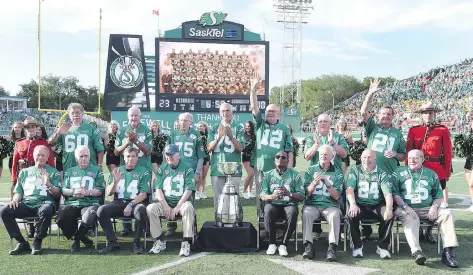  ?? PHOTOS: DON HEALY ?? Fifteen members of the 1966 Saskatchew­an Roughrider­s, the franchise’s first Grey Cup championsh­ip team, were present for a ceremony that was held at halftime of Saturday’s game. They are: front row, from left, Wally Dempsey, Wayne Shaw, Ron Cobbledick,...