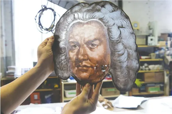  ?? PHOTOS: CHRIS YOUNG/THE CANADIAN PRESS ?? Johann Sebastian Bach is among the 125-year-old stained-glass depictions of composers and musicians being meticulous­ly restored and replaced at Toronto’s famed Massey Hall. The work is part of a two-year, $139-million revitaliza­tion project.