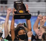  ?? AUSTIN HERTZOG — MEDIANEWS GROUP ?? Game-winning goal scorer Leah Malone raises the trophy after Pennridge won the PIAA 4A championsh­ip on Saturday.