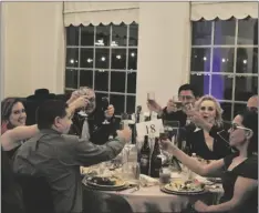  ?? MARCIE LANDEROS PHOTO ?? The Los Vigilantes table raise a toast together during the Imperial Valley Regional Chamber of Commerce 16th Annual Air Show Gala on Friday, February 24, in El Centro.