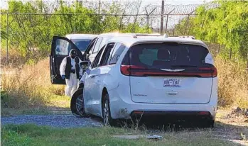  ?? AP ?? A Mexican police investigat­or inspects the minivan left behind after four Americans were shot and taken the previous week, at the Tamaulipas State Prosecutor headquarte­rs in Matamoros, Mexico, on Wednesday.
