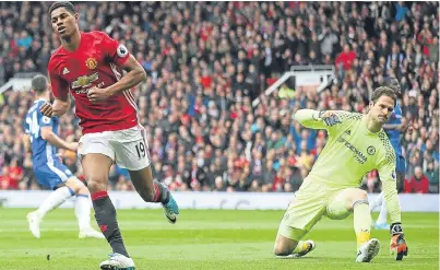  ?? Picture: PA. ?? Marcus Rashford turns to celebrate after scoring Manchester United’s opening goal against Chelsea.