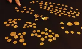  ?? Photograph: British Museum/PA ?? Some of the gold coins, discovered in west Norfolk and thought buried around 600AD. Most are Frankish tremisses.