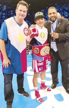  ??  ?? IBF superflywe­ight champion Jerwin Ancajas is flanked by IBF president Daryl Peoples (right) and matchmaker Sean Gibbons after retaining his title in Belfast.