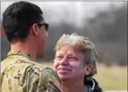  ?? MARIAN DENNIS – DIGITAL FIRST MEDIA ?? Donna Knapper of Pottstown smiles as she sees her son, Chad Carvalho, 34, who is an active duty Army maintenanc­e test pilot.