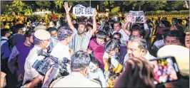  ?? —PTI ?? Delhi Congress workers hold placards reading 'Get Well Soon Kapil Sibal’ stage a protest against senior party leader Kapil Sibal outside his residence in New Delhi on Wednesday.