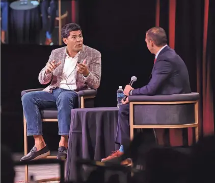  ?? MATT PARKER PHOTO ?? Former New England Patriot and three-time Super Bowl champion Tedy Bruschi talks with emcee Mike Mutnansky at The Brook Casino in Seabrook on Wednesday. Bruschi spoke about his 13-year NFL career and his foundation Tedy’s Team.