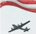  ?? MARK WILSON/GETTY IMAGES ?? A B-29 bomber flies over the National Mall in Washington, D.C., during a ceremony marking the 70th anniversar­y of V-E Day.