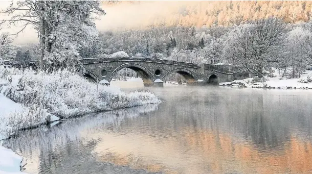  ??  ?? STUNNING: Kenmore In The Grip Of Winter, by Phil Cooke, won the Scottish Landscape Photograph­er Of The Year award, winter scene category.