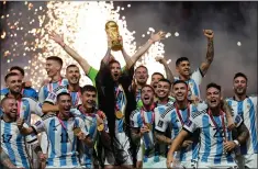  ?? ASSOCIATED PRESS FILE PHOTO ?? Argentina’s Lionel Messi lifts the trophy after winning the 2022World Cup final soccer match between Argentina and France at the Lusail Stadium in Lusail, Qatar. Just over a year on from Messi winning the World Cup, what sporting legacy has it left in Qatar?